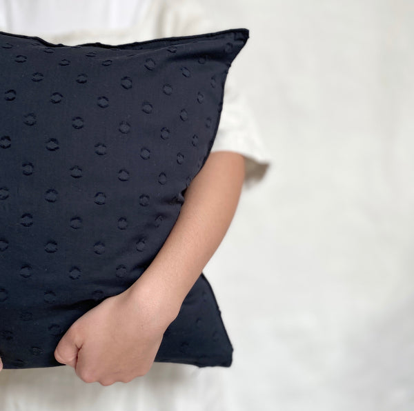 dotted black pillow
