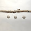 felted wool balls (in cotton bag)