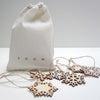 bag of wooden snowflakes