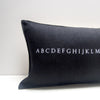 black alphabet pillow