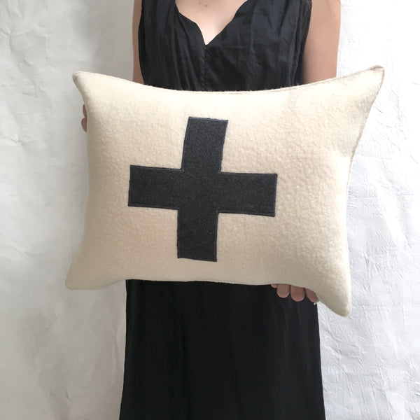 applique wool pillows. cream with black cross