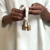 set of three brass bells
