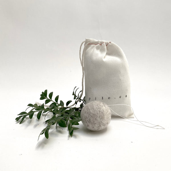 felted wool balls (in cotton bag)