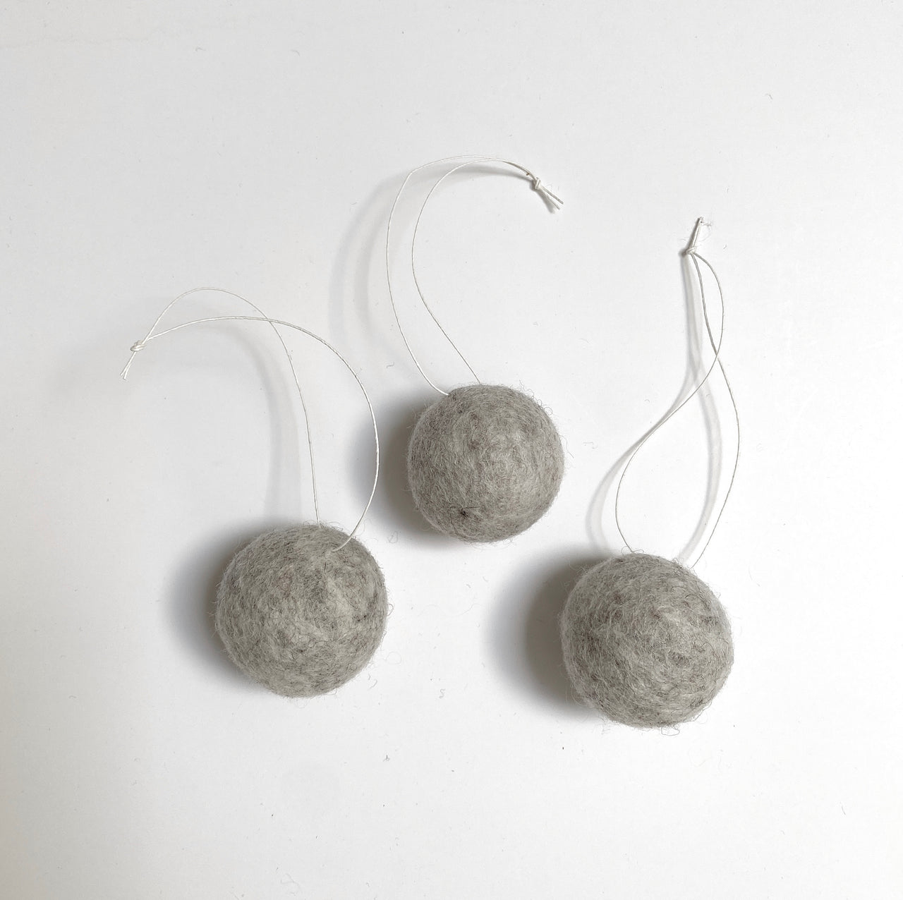 felted wool balls (in cotton bag)