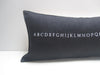 black alphabet pillow