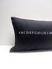 black alphabet pillow