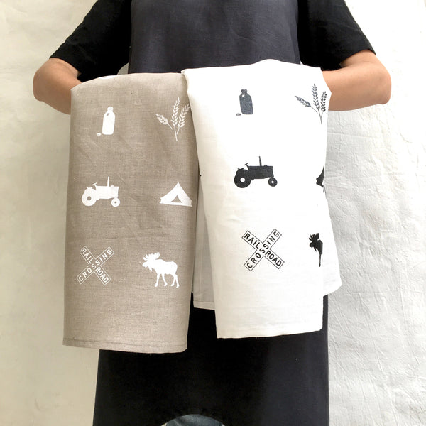 white linen tea towel with housekeeping definition pi'lo