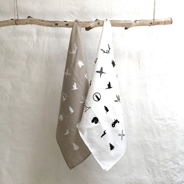 white linen tea towel with housekeeping definition pi'lo