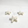 set of 3 felted wool stars (in cotton bag)